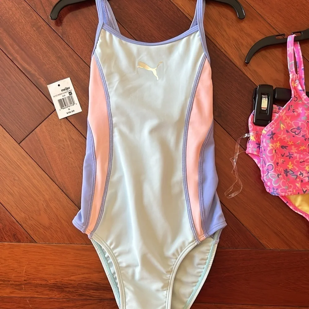 Girls set of swimsuits, pink set is a 7/8 and the one piece is a small.
